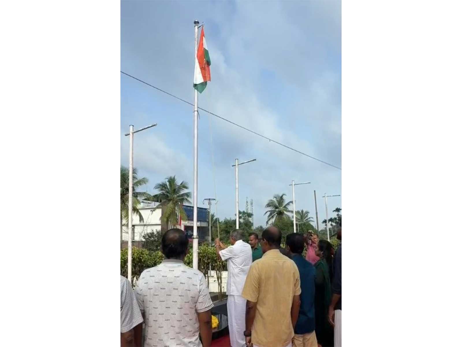 Keralam LoP Pinarayi Vijayan hoists Tricolour at MLA office in Kannur on Independence Day