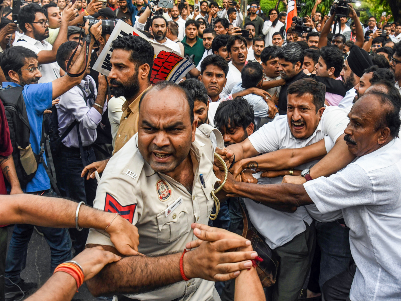 Police personnel on duty during Wednesday's opposition protest detail being subject to physical assault by cadres