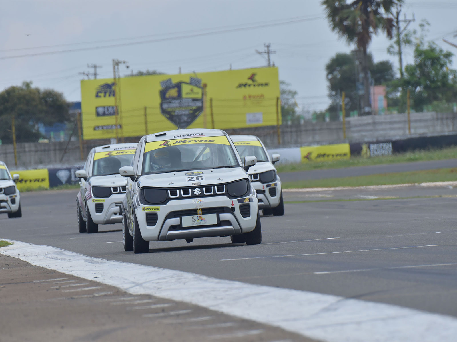 Last-corner chaos, a 0.004-second photo finish and a rain-called finale close Round 1 of FMSCI Indian National Car Racing Championship 2026