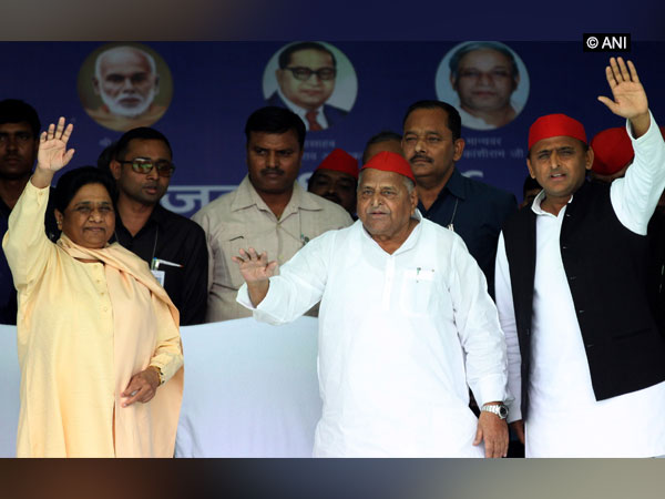 BSP chief Mayawati and SP leaders Mulayam and Akhilesh Yadav waving to the people at a rally here on Friday. Photo/ANI