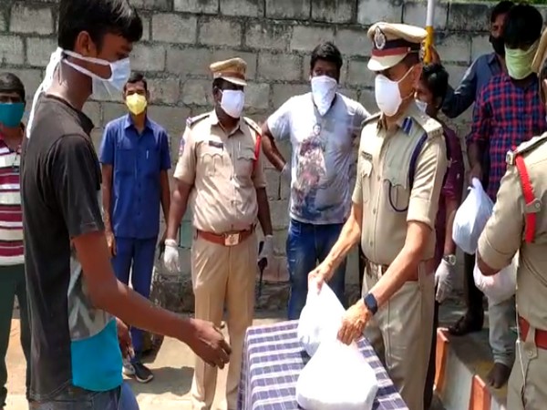 Karimnagar Police Commissioner VB Kamalasan Reddy distributed essential commodities to families of daily wage labourers. Photo/ANI