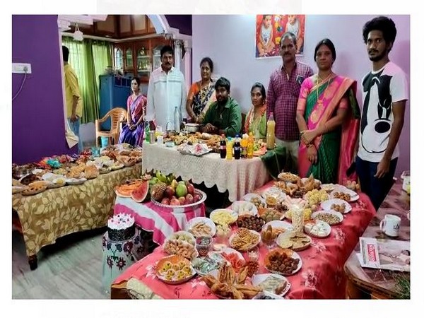 The couple with family and 365-different types of food. (ANI/photo)