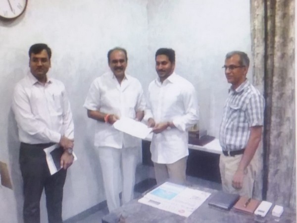State Power Minister Balineni Srinivas Reddy handing over the cheque to Chief Minister YS Jaganmohan Reddy at his camp office in Tadepalli, Amaravati on Tuesday.