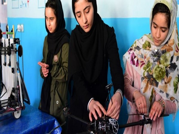 Young girls work on a robotics project in Afghanistan. (Photo Credit: UNICEF)