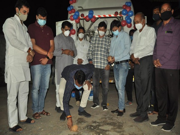 BJP leaders performing a puja in front of a tanker.