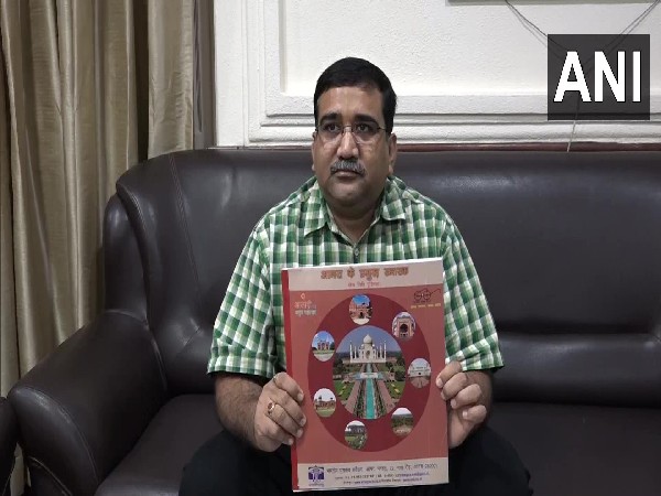 ASI Superintendent Basant holding the book (Photo/ANI)