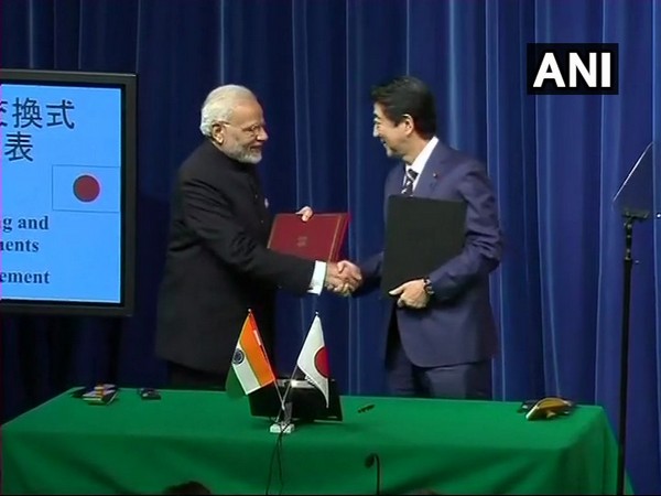 Prime Minister Narendra Modi while shaking hands with his Japanese counterpart Shinzo Abe during 2018 October meeting in Tokyo. (Photo: ANI)
