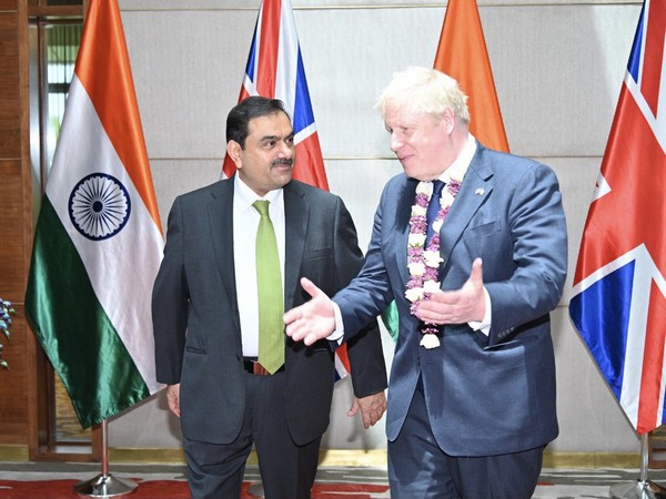 British Prime Minister Boris Johnson and Adani Group Chairman Gautam Adani at Adani global headquarters. (twitter/@gautam_adani) 