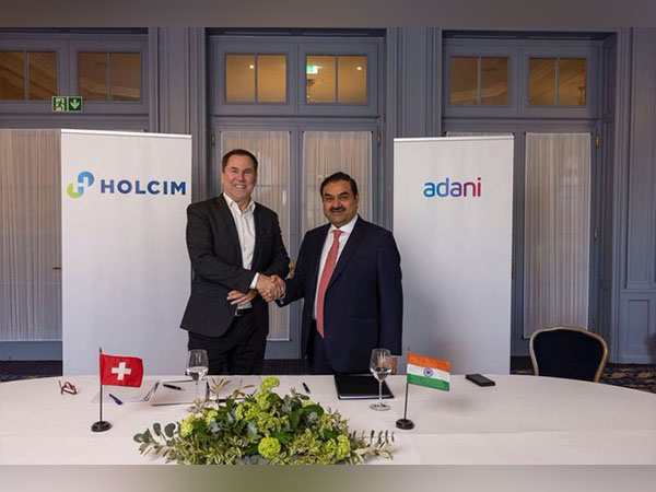 Gautam Adani, Chairman, Adani Group, (right) and Jan Jenisch, CEO, Holcim. (Photo/Twitter/gautam_adani) 