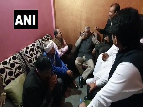 Congress leader Adhir Ranjan Chowdhury at the residence of IB officer Ankit Sharma on Sunday.