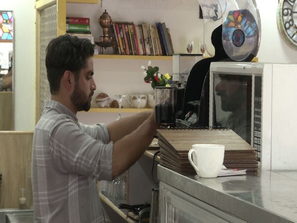 Adil Farooq in his café in Srinagar. Photo/ANI