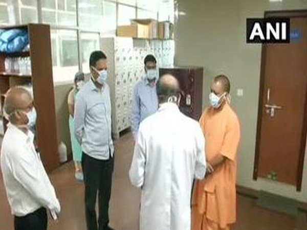 Uttar Pradesh Chief Minister Yogi Adityanath speaking to doctor and administrative officials of SGPI to take stock of the arrangements made for the COVID-19 patients on Saturday. Photo/ANI