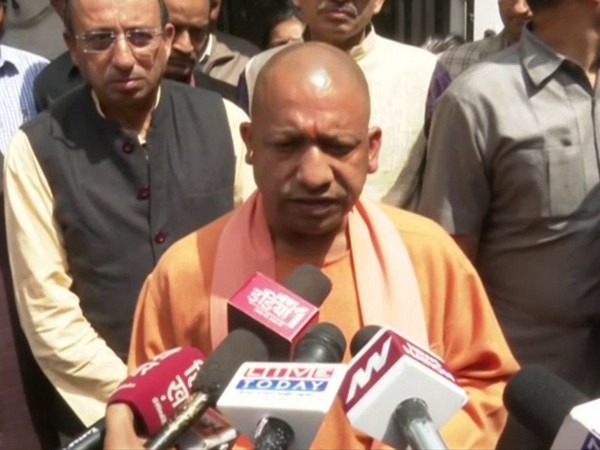 Uttar Pradesh CM Yogi Adityanath speaking to reporters in Lucknow on Monday. photo/ANI