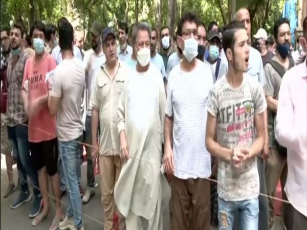 Afghans protesting outside UNHRC office in New Delhi on Wednesday, demanding refugee cards. (ANI)