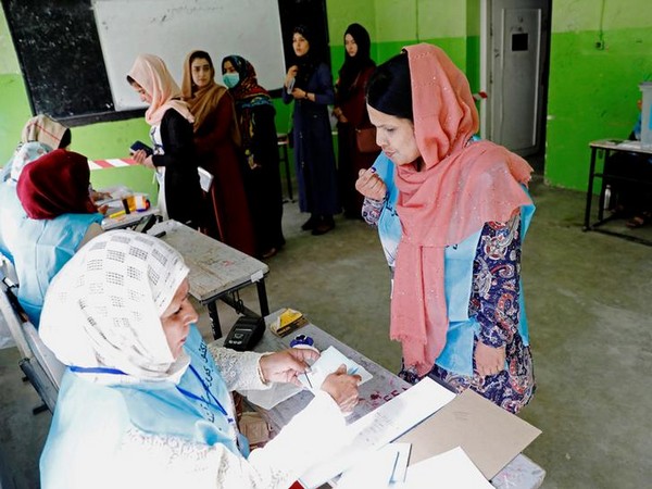 A woman gets her finger inked at a polling centre in Afghanistan on Saturday. (Photo Credits: Reuters)