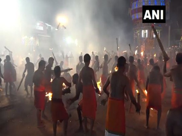 Devotees throw burning fronds at each other in 'Agni Kheli' festival (Photo/ANI) 