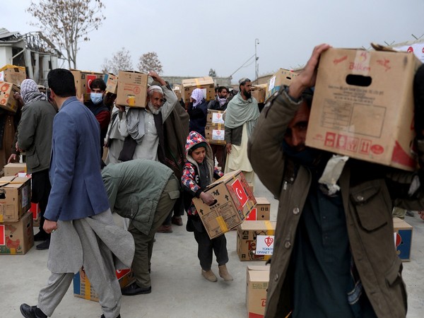 Packages from a Turkish humanitarian aid group distributed amongst Afghans in Kabul. (Photo Credit - Reuters)