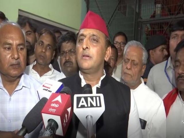 Samajwadi Party chief Akhilesh Yadav speaking to reporters on Sunday. 