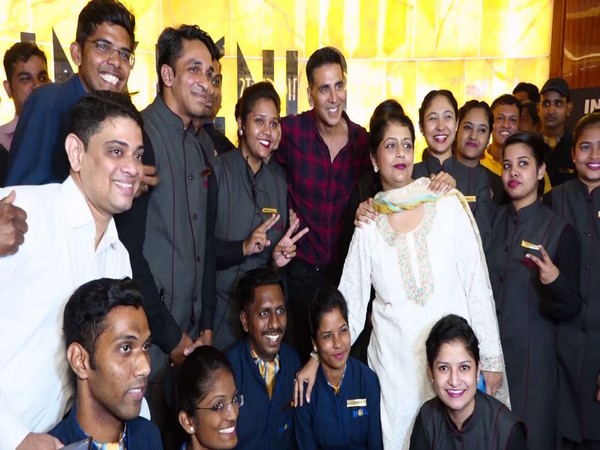 Akshay Kumar posing with fans after the film screening