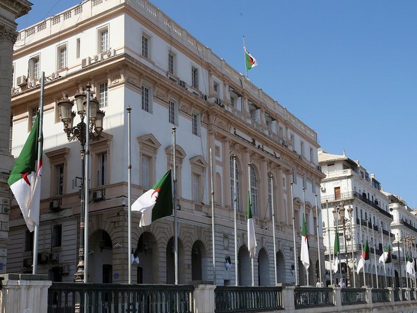 Algerian flags fly at half mast outside the Council of the Nation in Algiers. (Photo Credit - Reuters)