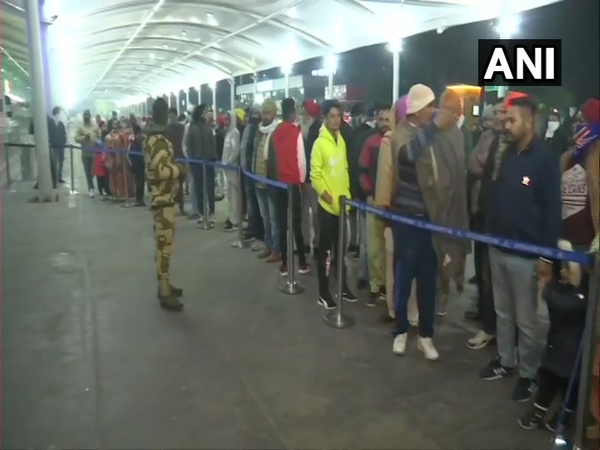 Passengers arriving from the UK Amritsar are waiting in a long queue to get themselves tested for COVID-19 in the wake of the new virus coronavirus strain.