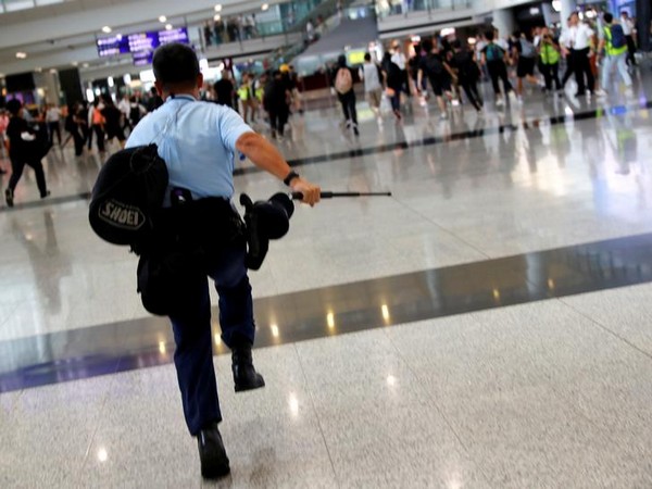 An earlier incident of police chasing mob at Hong Kong airport. (File photo) 