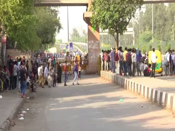 Several people were left stranded at Delhi's Anand Vihar bus terminal on Sunday as the governments of UP and Delhi announced lockdowns to check the spread of COVID-19. Photo/ANI