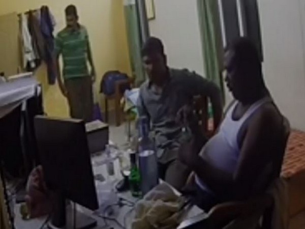 A visual of three constables consuming alcohol inside the Hindupur town police station, Andhra Pradesh. (Photo/ANI)