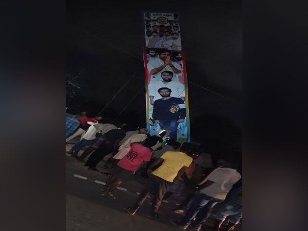 The poster being erected by youth at Kanamaladoddi village, Chittoor on Tuesday. Photo/ANI