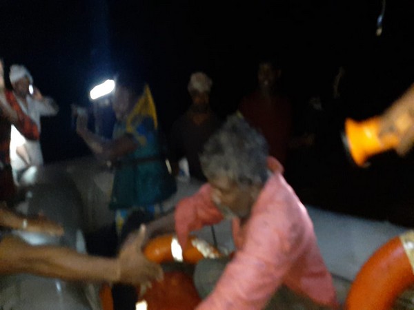 SDRF recues four people after water level rose in Munneru stream in Andhra Pradesh due to heavy rain on Thursday. Photo/ANI