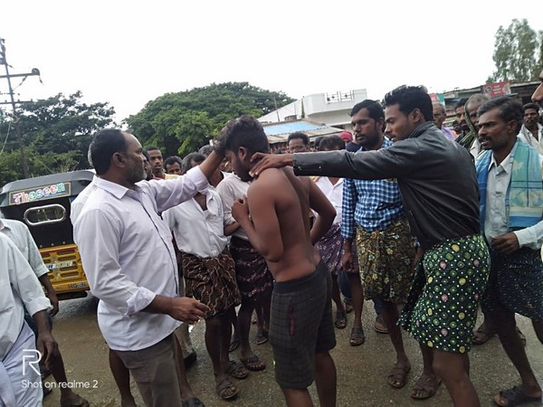 The accused of eve-teasing being beaten up by locals in Chittoor district on Sunday. (Photo/ANI)