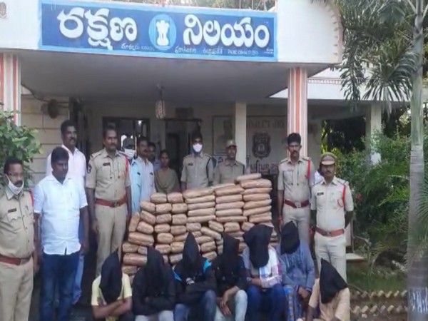 Andhra Pradesh police with ganja and accused. (Photo/ANI)