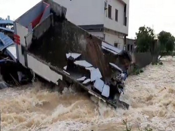 Canal in Ramavaram overflows due to heavy rainfall, normal life disrupted. Photo/ANI