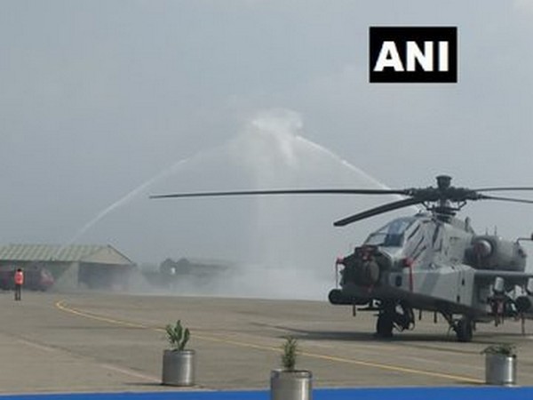 The Apache choppers receive water cannon salute, before induction at the Pathankot Air Base. Photo/ANI