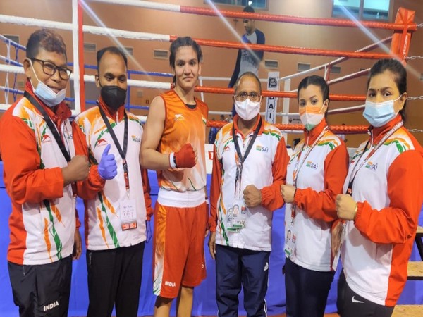 Arundhati Choudhary poses after winning her pre-quarterfinals bout