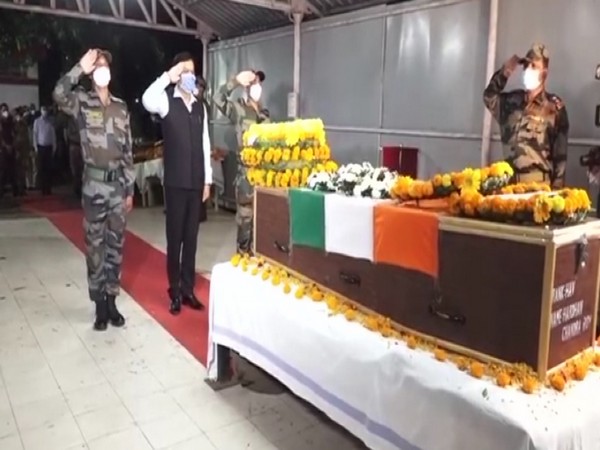 Assam CM Sarbananda Sonowal pays tribute to the mortal remains of soldiers on Sunday. Photo/ANI