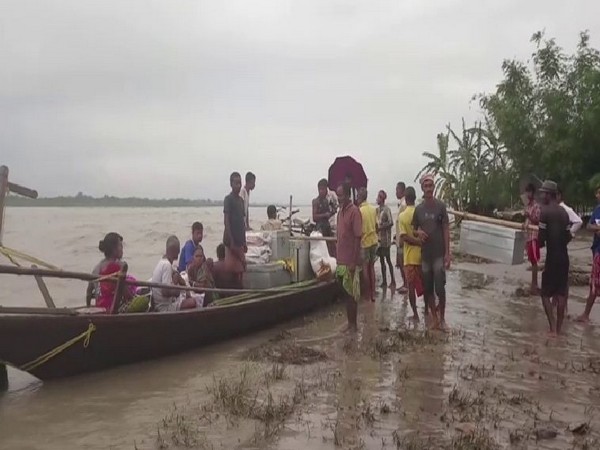 Residents of Dababil village of Chirang district in Assam flee as floods threaten their lives