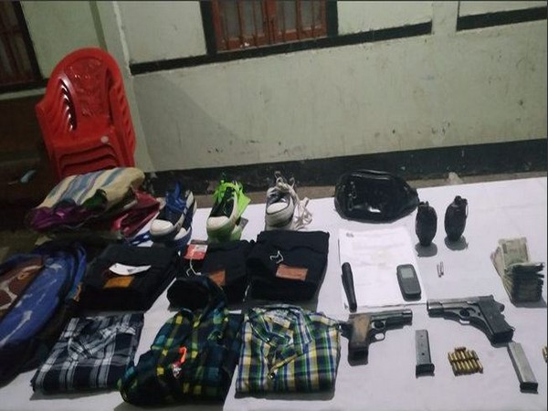 Arms and ammunition were recovered by security forces from the gunned down terrorist's possession on Monday. Photo/ANI