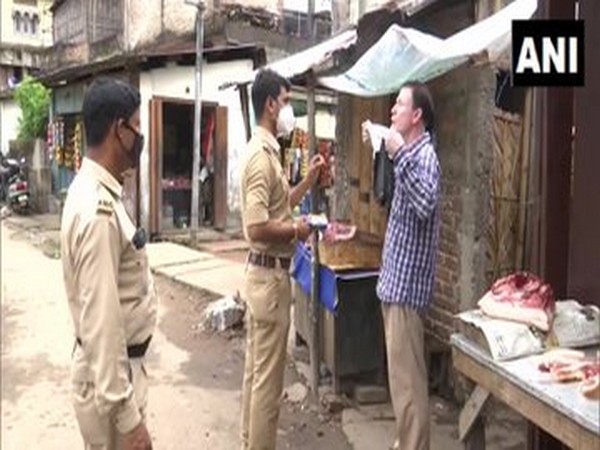 Police impose fine on people found without mask in Guwahati. Photo/ANI