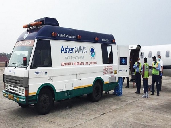 Medical emergency professionals assist in the transport of the patient from Kozhikode Airport to Aster MIMS Hospital