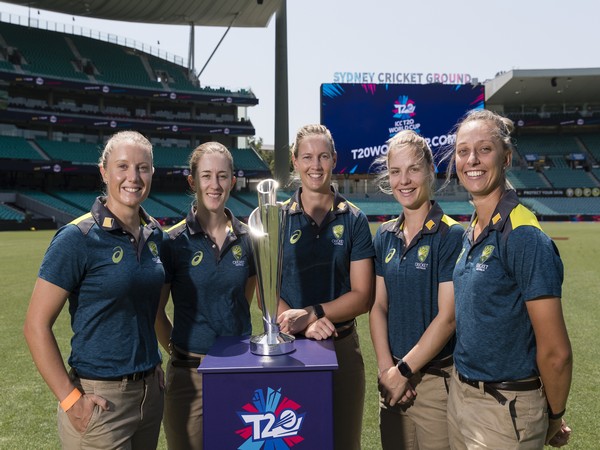 Defending champions and Australian cricketers with ICC Women's T20 World Cup 2020 trophy