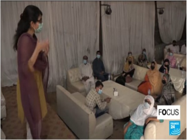 A COVID-19 vaccination awareness campaign held in Lahore (Photo Credit - France24)