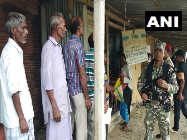 People queue up outside a NRC Seva Kendra to check their name in the National Register of Citizens (NRC) final list in Barpeta [Photo/ANI]