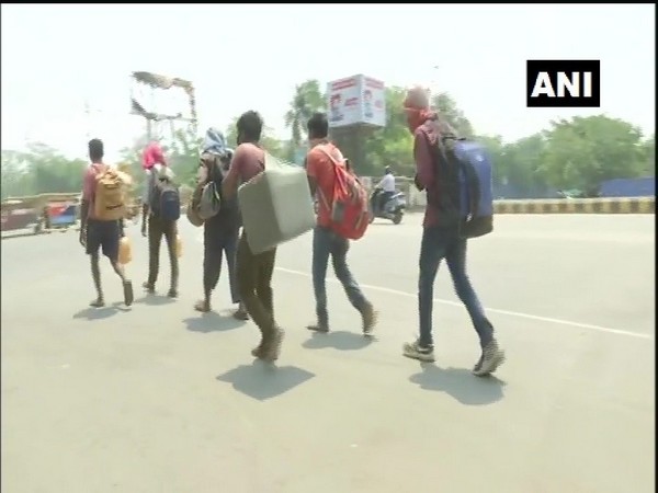 Migrant workers walking to Jharkhand from Delhi. Photo/ ANI