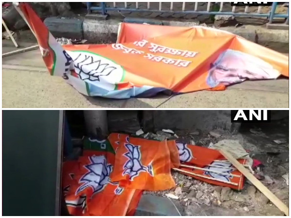 BJP's party flags and posters lying on a road in Kolkata.
