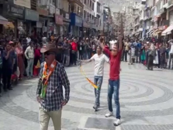 BJP workers celebrating the scrapping of section 370 on Monday in Leh. Photo/ANI