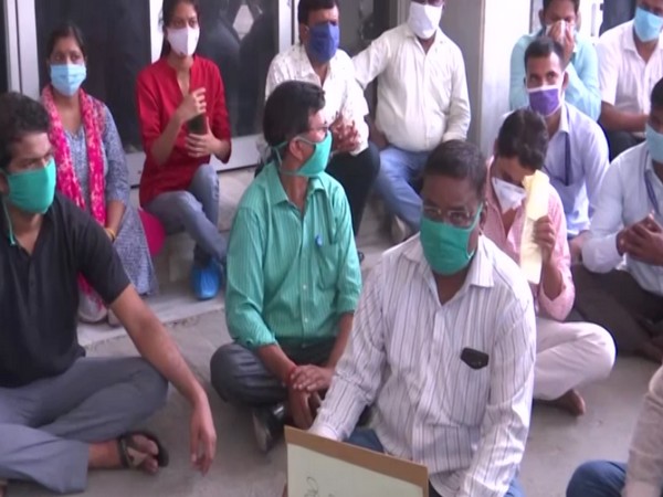 Lab technicians and medical staff sit on protest at BRD Medical College in Gorakhpur on Wednesday. [Photo/ANI]