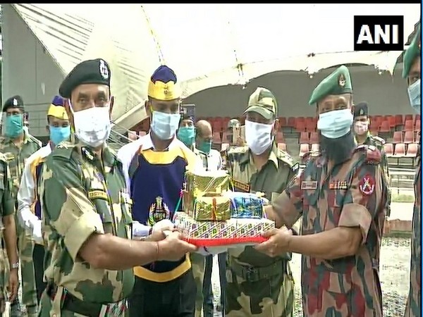 BSF and BGB exchanged sweets at Petrapole border on Saturday. (Photo: ANI)