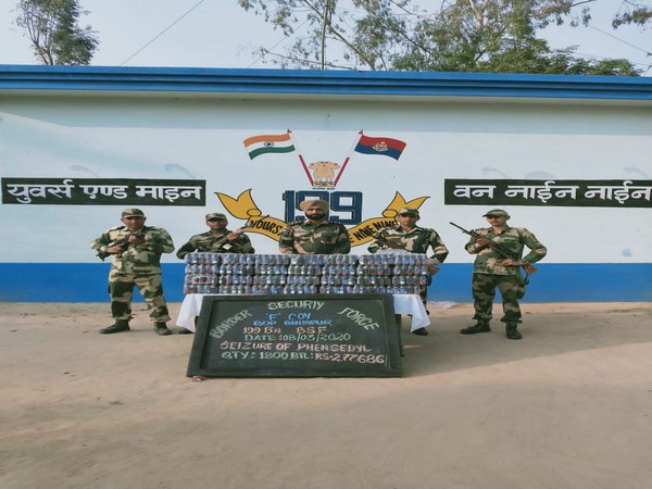 BSF troops with the Phensedyl bottles which were seized on Sunday. Photo/ANI