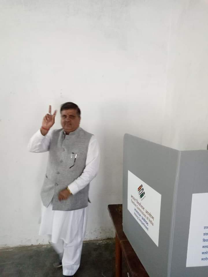 BJP MLA Mahendra Bhatt at a polling booth in Badrinath